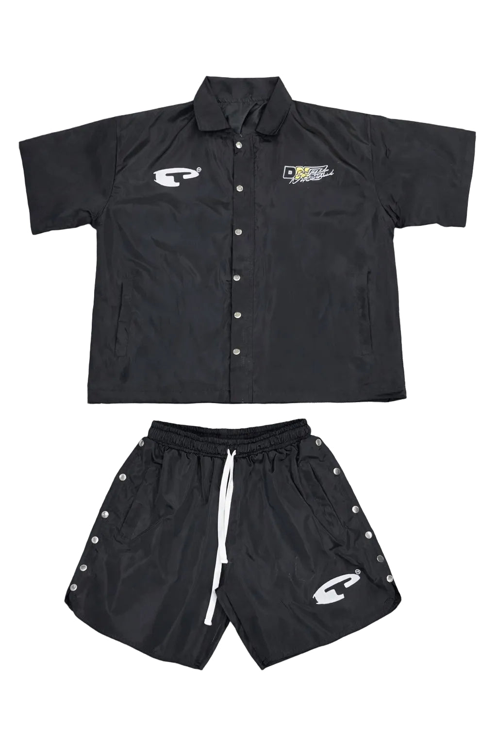 Black shirt and shorts set with logos on a gray surface