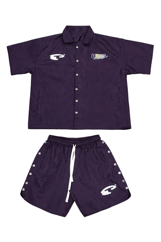 Purple sports outfit with button-up shirt and shorts on a gray background
